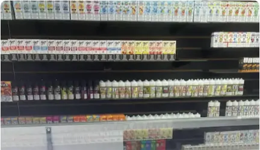 Mega Tobacco Vape & Wireless long lit shelving run of cigarette and tobacco packs inside the Scotland Neck store