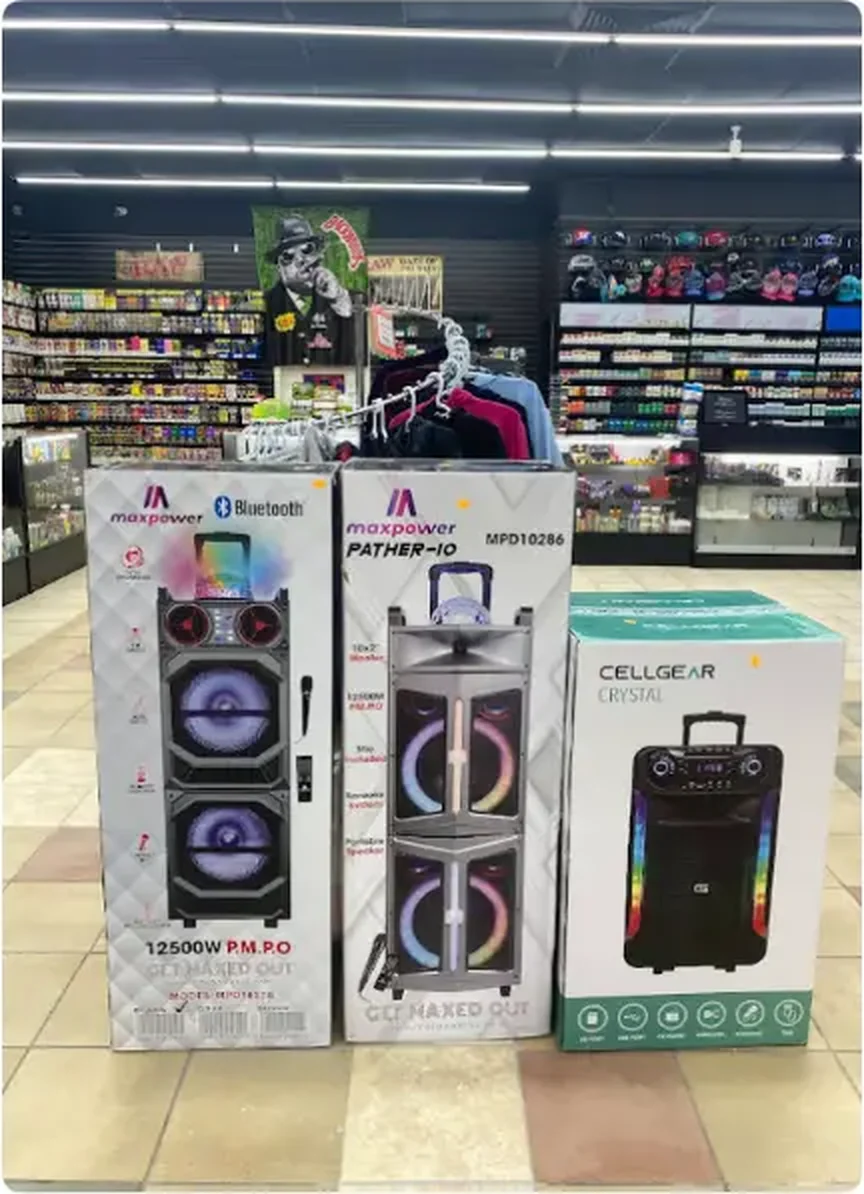 Boxed portable Bluetooth party speakers on display on the sales floor at Mega Tobacco Vape & Wireless