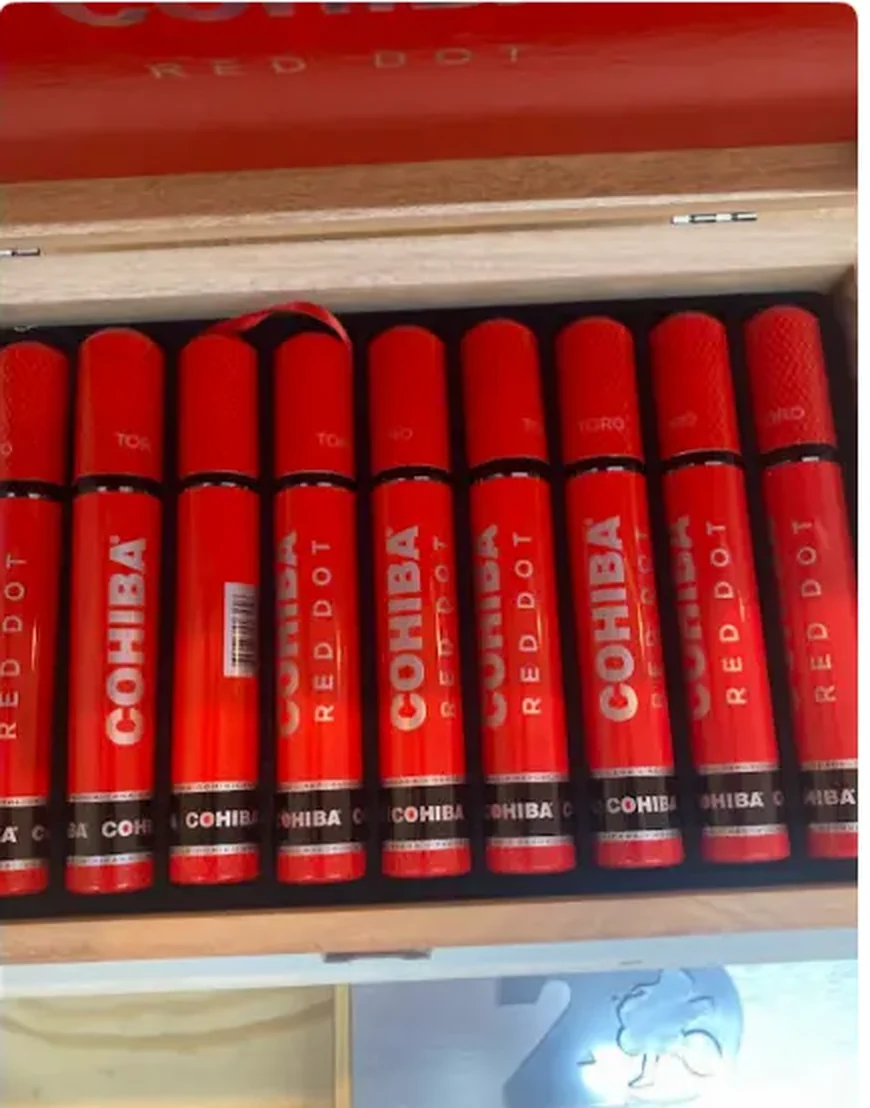 Row of tubed cigars displayed in an open box on the cigar shelf at Mega Tobacco Vape & Wireless
