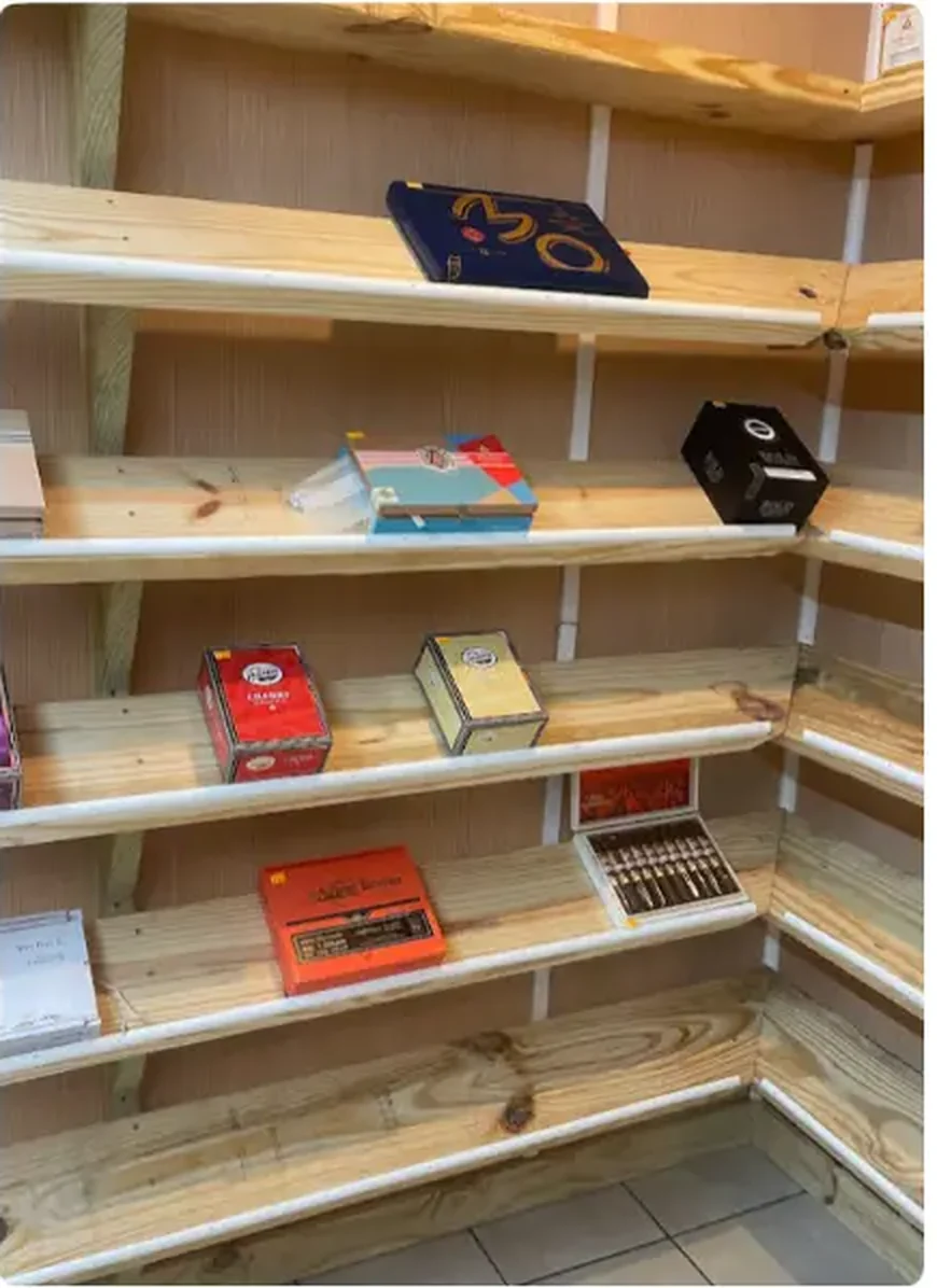 Mega Tobacco Vape & Wireless wide view of the wooden cigar display wall inside the Scotland Neck store
