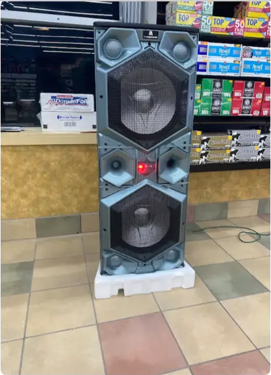 Large portable Bluetooth speaker standing beside the front counter at Mega Tobacco Vape & Wireless